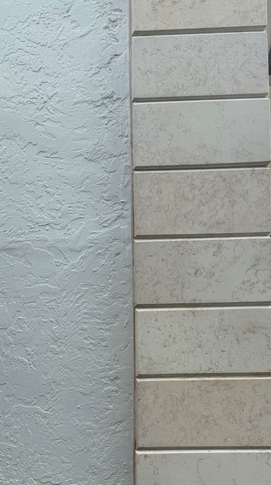Stone frontage — black algae and organic staining lifted out of the block work and stucco. after